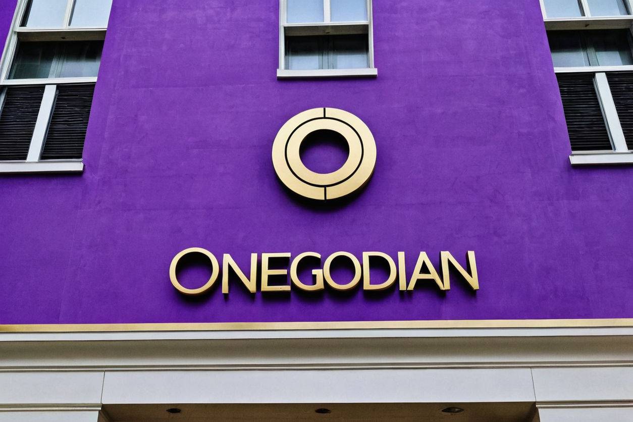 an-ultra-realistic-image-of-onegodian-sign-on-a-building-in-a-city-welcome-to-onegodian--32k-hir-958368658
